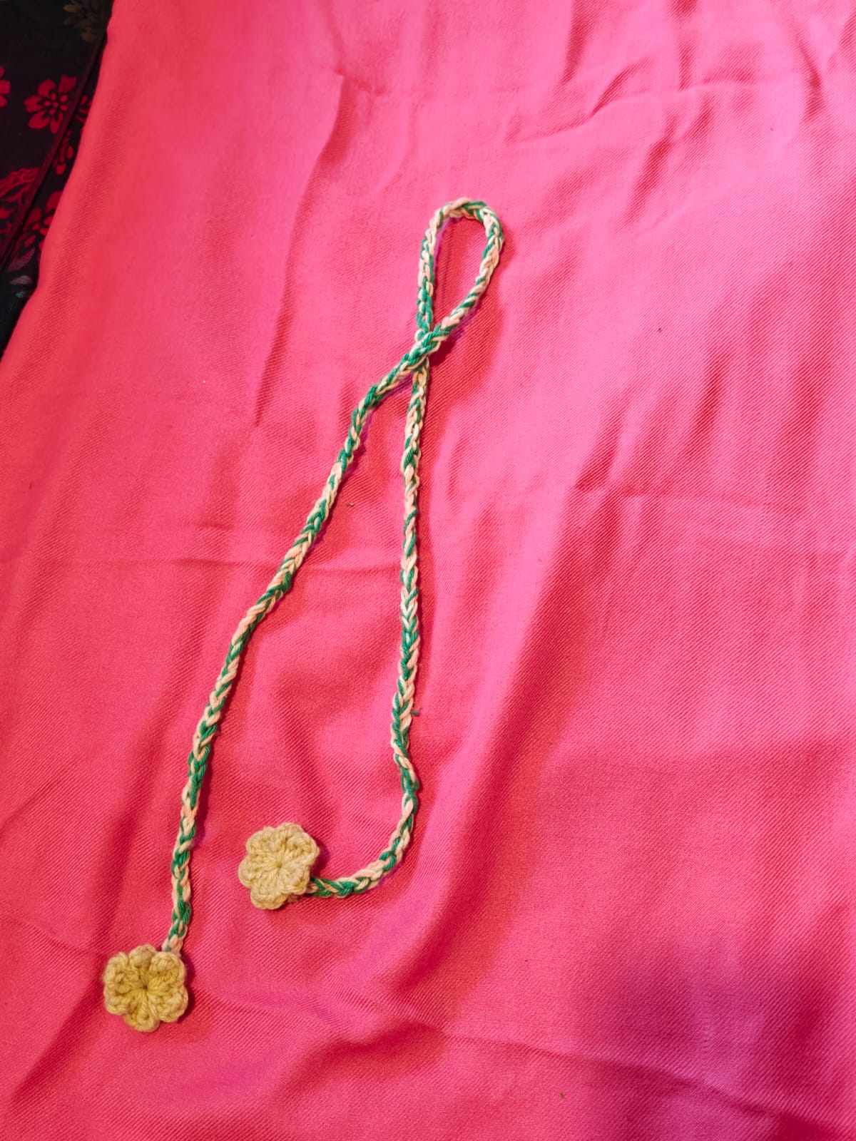 Braided hair cord with flowers