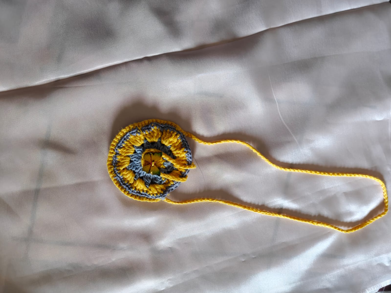 Spiral flower necklace in yellow and grey